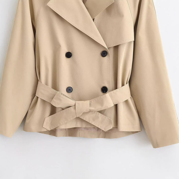 Women's short trench coat with wide cut, double-breasted button placket and waist belt Mune Fashion