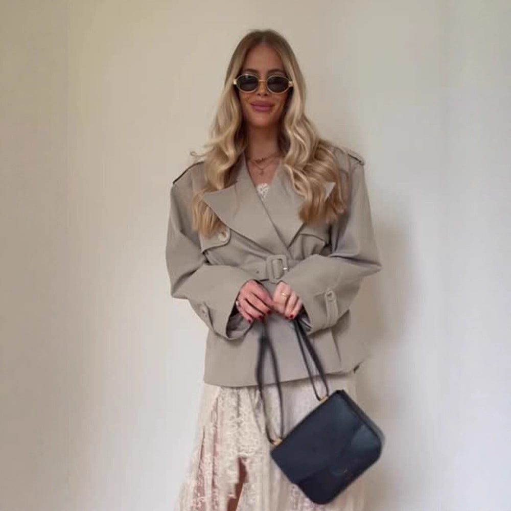 Women's short trench-style jacket with a tailored tie belt and wide sleeves Mune Fashion