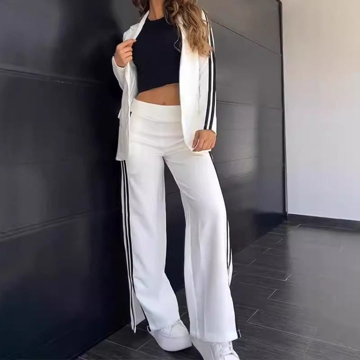 Ladies nan sporty-elegant two-piece blazer set with fitted blazer and wide jogging pants cut with side stripes Mune Fashion