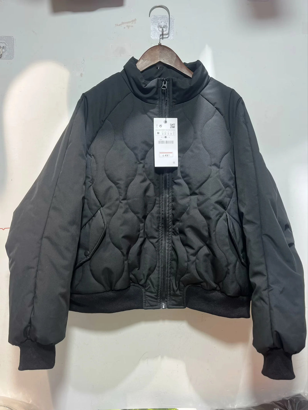 Women's quilted bomber jacket with high stand-up collar, lightweight thermal padding, and ribbed cuffs Mune Fashion