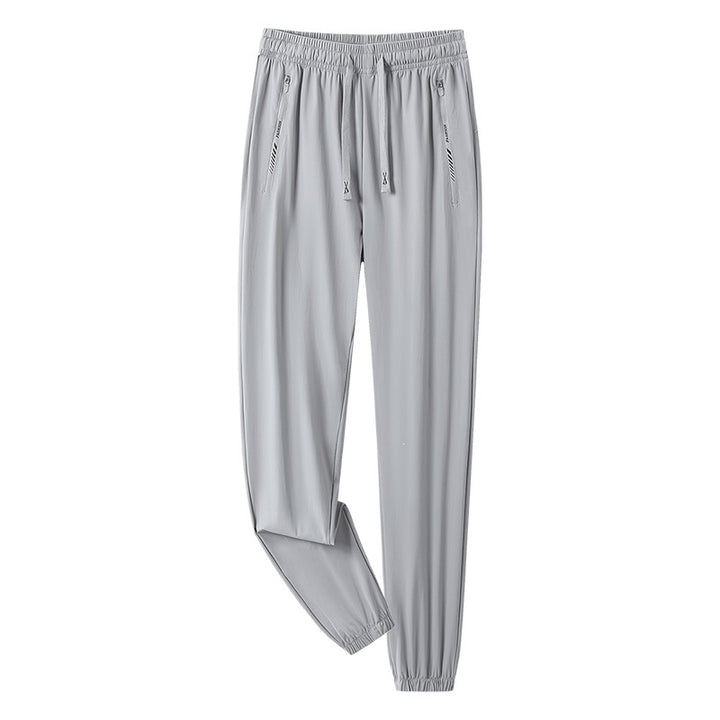 Men's sporty jogging pants with adjustable waistband and zippered pockets Mune Fashion
