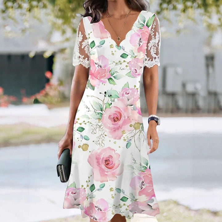 Women's A-line midi dress with wavy V-neck, all-over floral pattern and transparent lace sleeves Mune Fashion