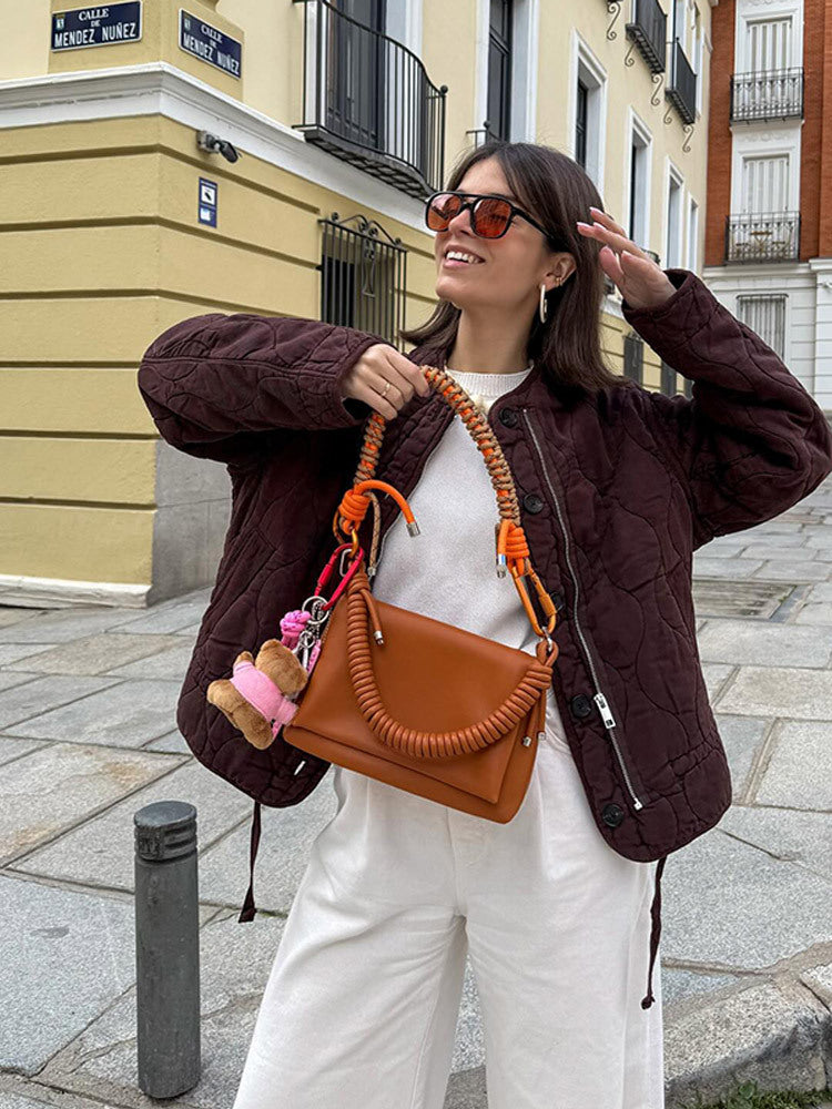 Women's shoulder bag made of synthetic leather with braided handle and spiral-shaped front grip Mune Fashion