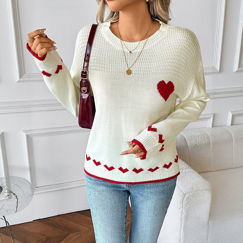 Ladies fine knit sweater with heart jacquard, lace structure, and ribbed hem