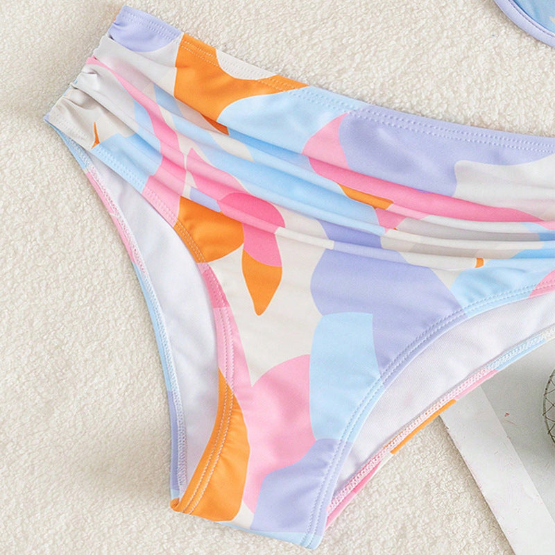 Ladies triangle bikini with asymmetrical design and high waistband Mune Fashion