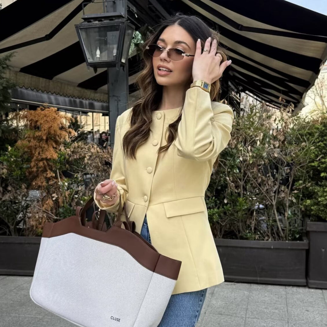 Women's tailored button blazer with round neckline and faux flap pockets Mune Fashion