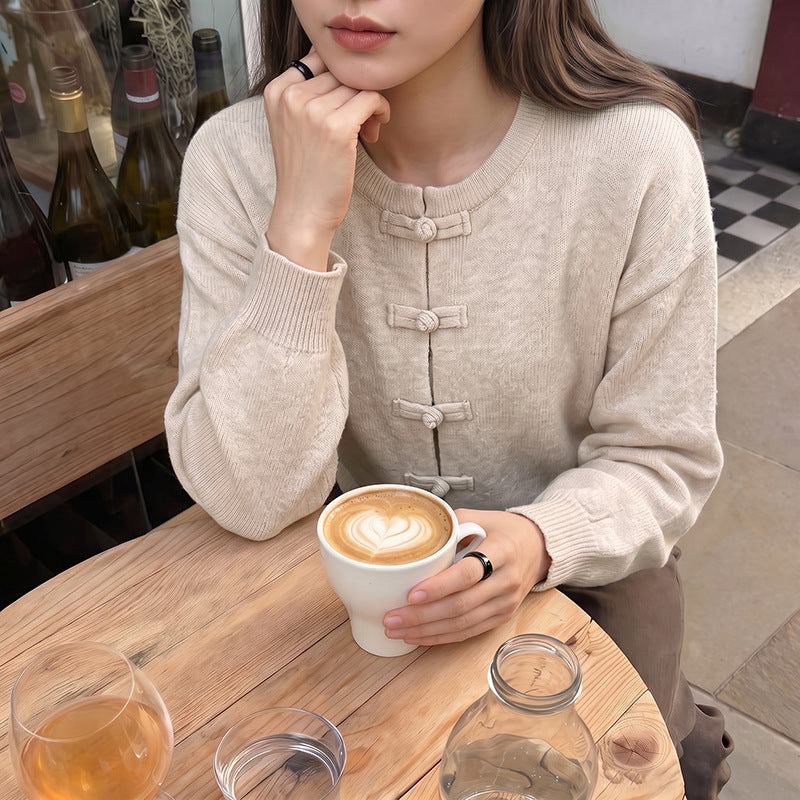 Women's fine knit cardigan with decorative knot closure and casual raglan silhouette Mune Fashion