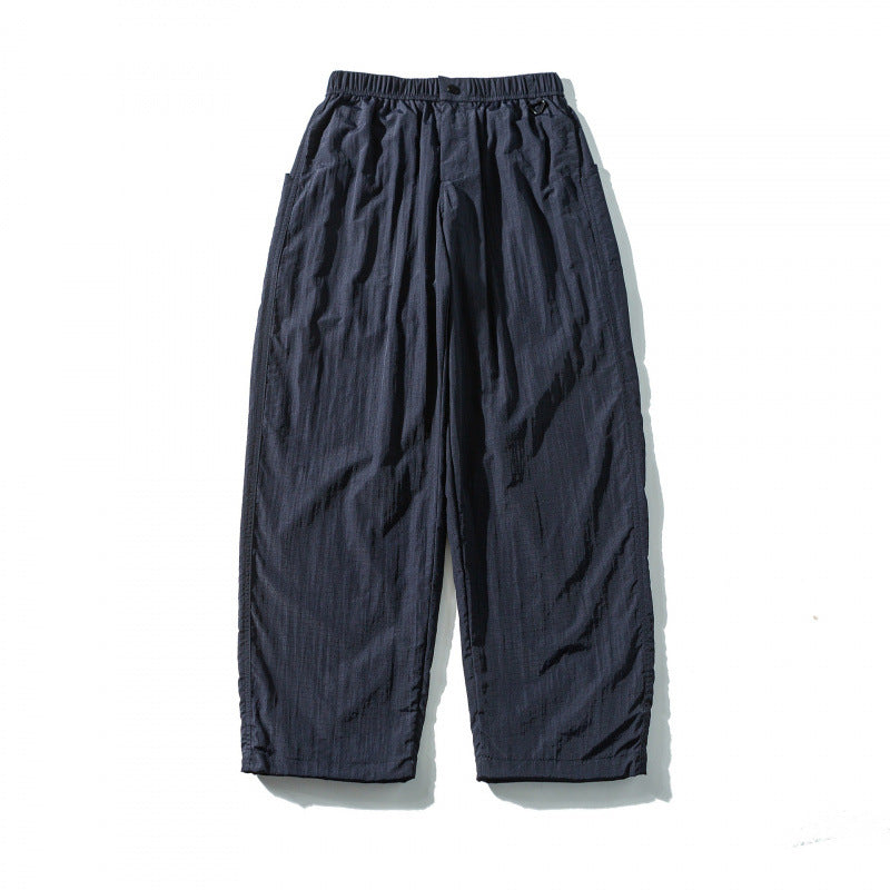 Unisex Loose Crinkle Pants with elastic drawstring waistband, drop-crotch, and side pockets Mune Fashion