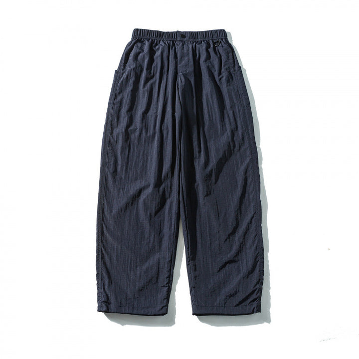 Unisex Loose Crinkle Pants with elastic drawstring waistband, drop-crotch, and side pockets Mune Fashion
