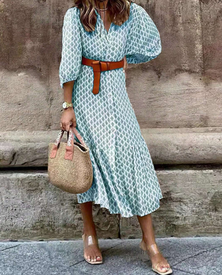 Women's lightweight patterned midi dress with V-neck, button placket, tiered skirt, and balloon sleeves Mune Fashion