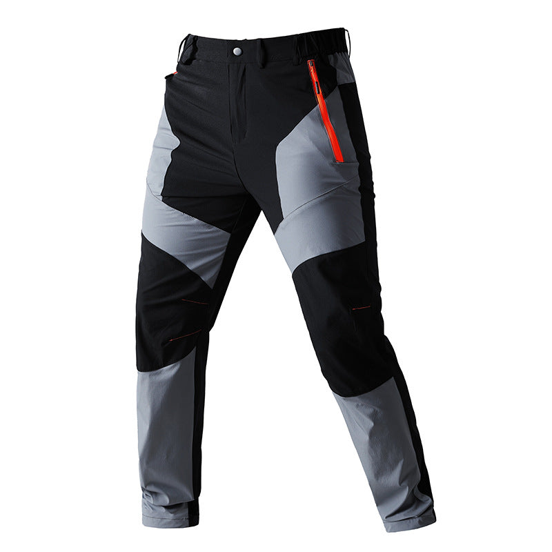 Men's functional trekking pants with reinforced knees, elastic waistband, and zipper pockets.