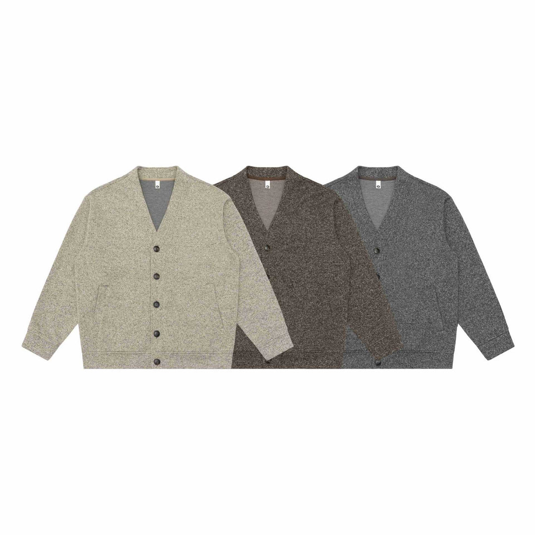 Unisex V-neck cardigan with textured knit and patch pockets Mune Fashion
