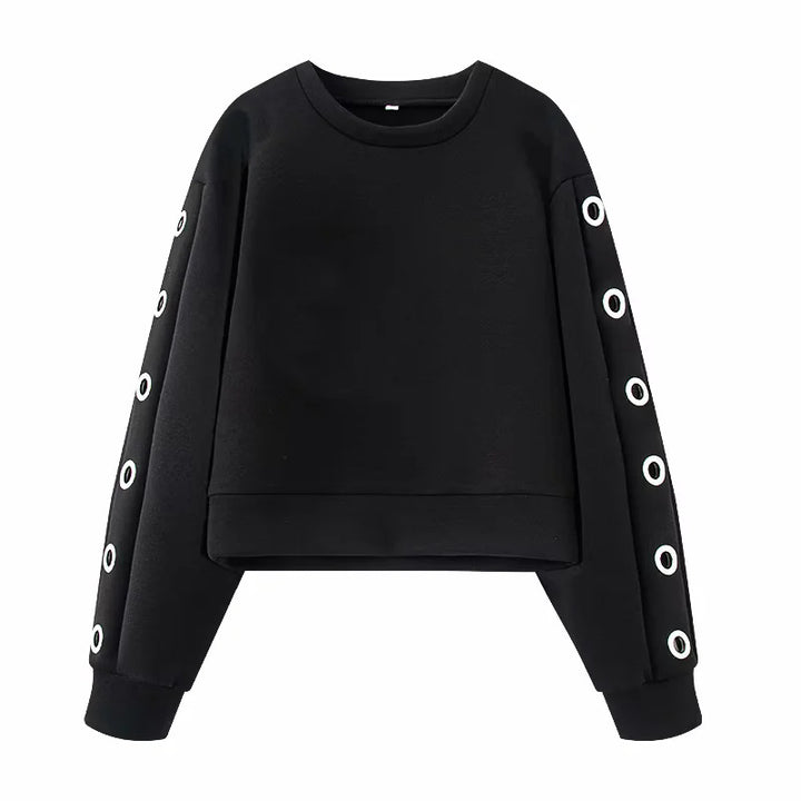Women's oversized sweatshirt with decorative metal eyelets on the sleeves Mune Fashion