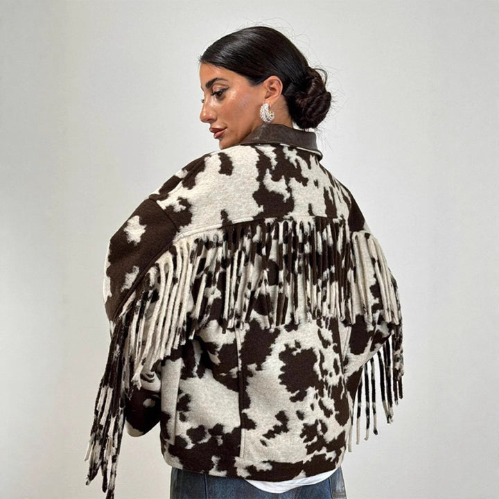 Ladies short jacket in cow print with fringes, faux fur look and leather collar Mune Fashion