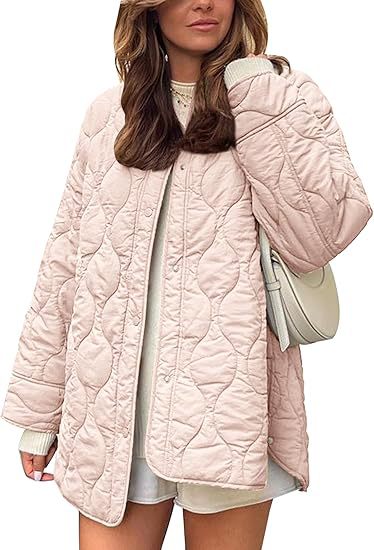 Women's quilted jacket in oversized design with curved quilting and side slit Mune Fashion