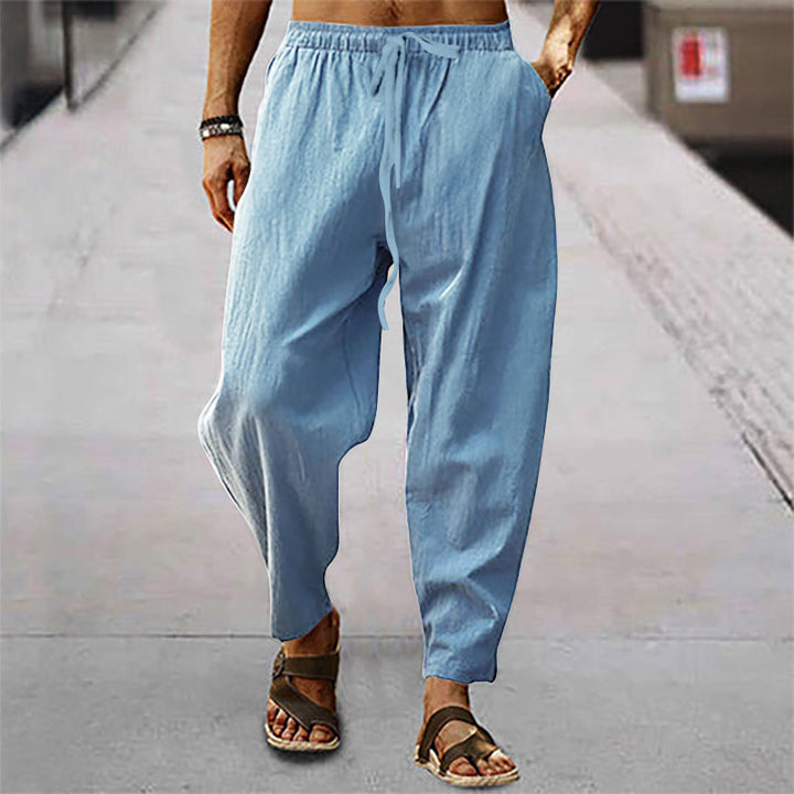 Men's loose linen casual pants with elastic tunnel drawstring waistband, low crotch, and tapered ankle length Mune Fashion