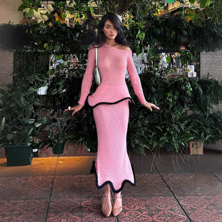 Women's fitted long ribbed knit dress with asymmetrical neckline, ruffled peplum and contrasting piping edge Mune Fashion
