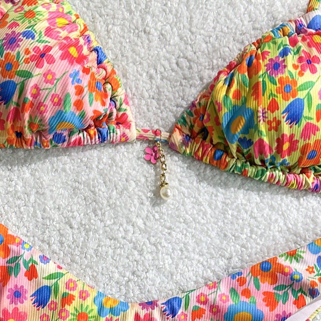 Women's triangle bikini with colorful floral design and fine ruffle details Mune Fashion