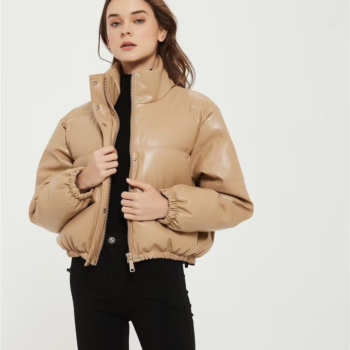 Women's short padded faux leather puffer jacket with high stand-up collar, snap button placket and drawstring hem Mune Fashion