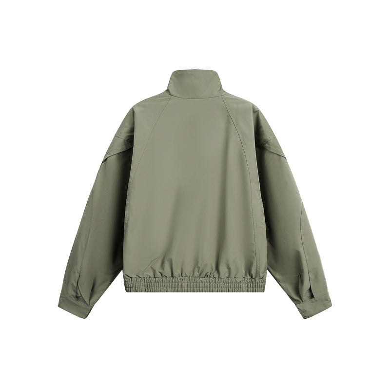 Unisex short jacket in minimalist tech fabric with funnel collar and concealed front placket Mune Fashion