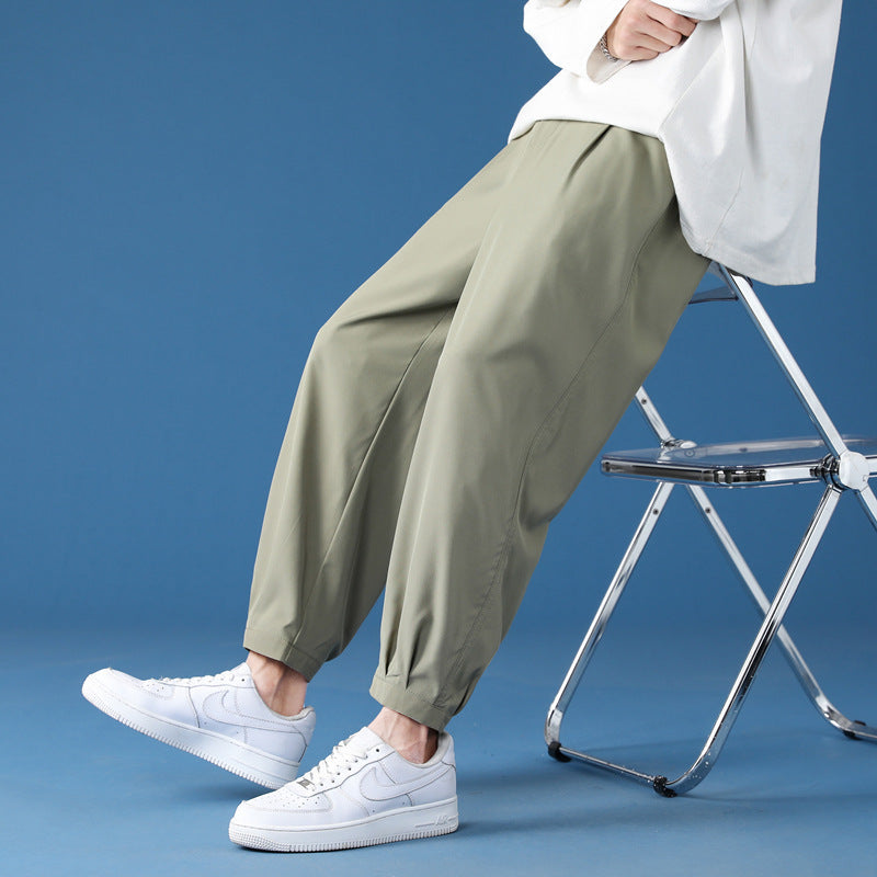 Men's wide technical jogging pants with elastic waistband, gathered leg cuffs, and breathable stretch material Mune Fashion