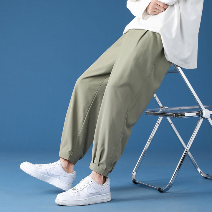 Men's wide technical jogging pants with elastic waistband, gathered leg cuffs, and breathable stretch material Mune Fashion