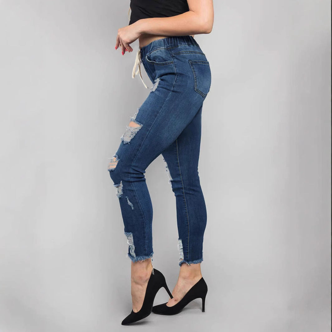 Women High-Waisted Destroyed Jogger Jeans with Elastic Drawstring Waistband and Cropped Frayed Hem Mune Fashion