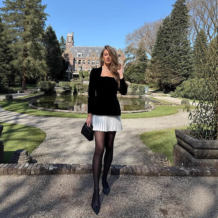 Women's velvet peplum dress with square neckline, sculpted shoulders and pleated mini skirt Mune Fashion