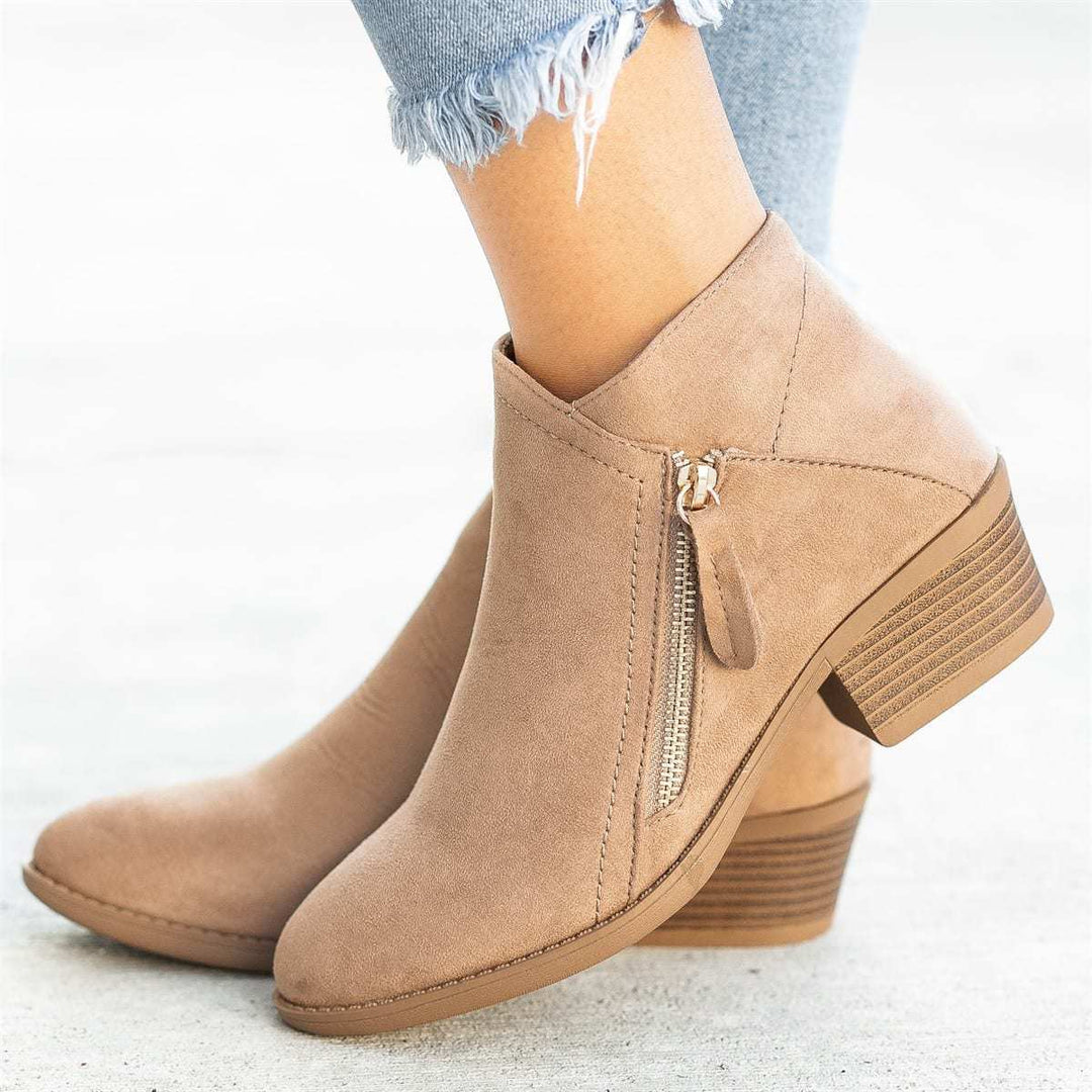 Ladies ankle-high suede-look ankle boots with a sleek round toe, side metal zipper, and stacked block heel Mune Fashion