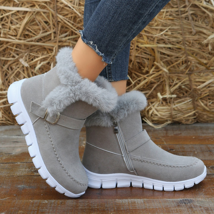 Women's non-fleece short boots with faux fur trim, suede leather look, side zipper, decorative metal buckle, and profiled lightweight sole Mune Fashion