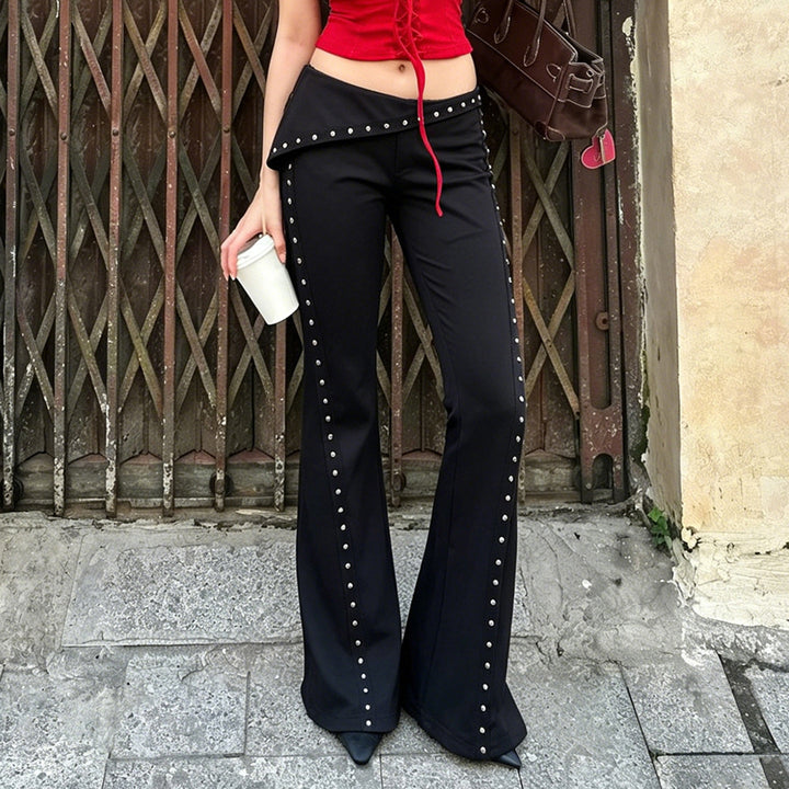 Women's flared pants with asymmetrical folded waistband and metal studs along the side seam Mune Fashion