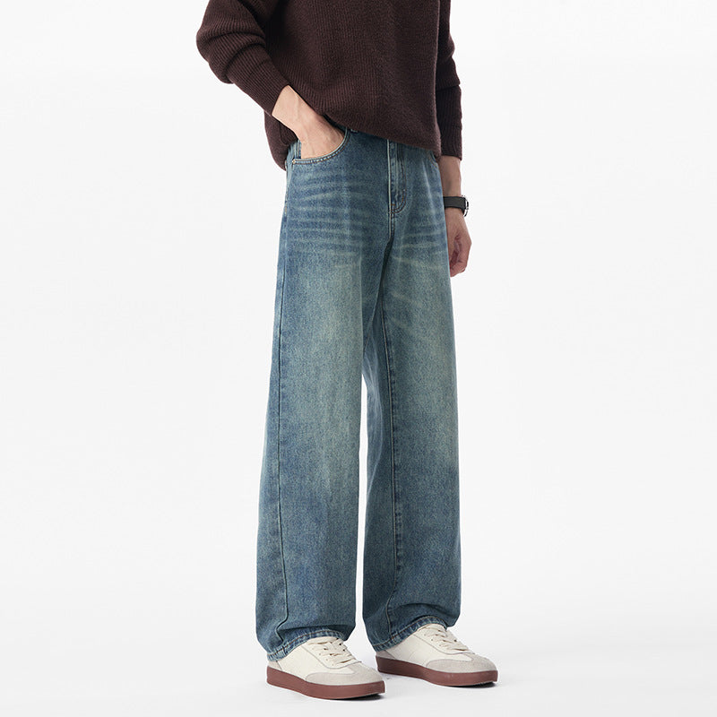 Men's baggy jeans made of heavy denim with a light used finish and a low crotch.