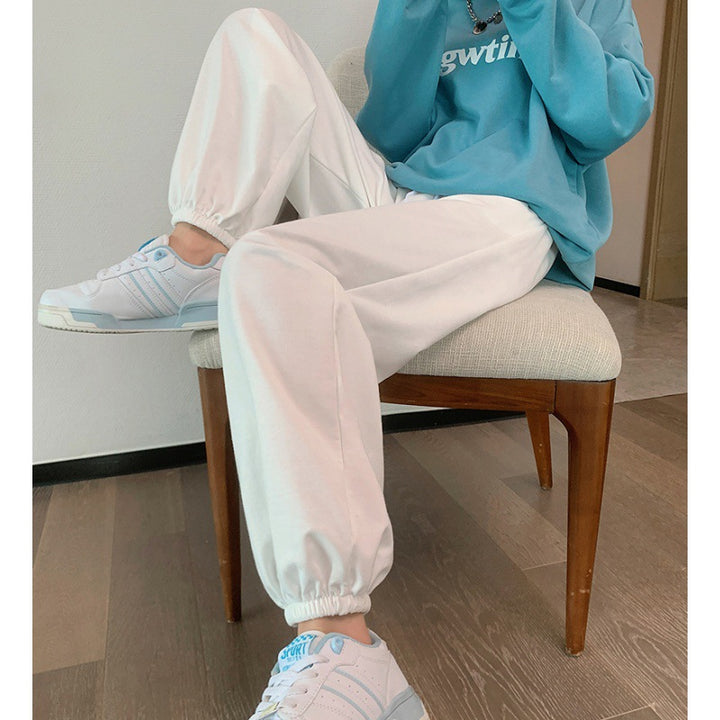 Women's relaxed-fit sweatpants with elastic drawstring waistband, side pockets, and stitched hem seams Mune Fashion