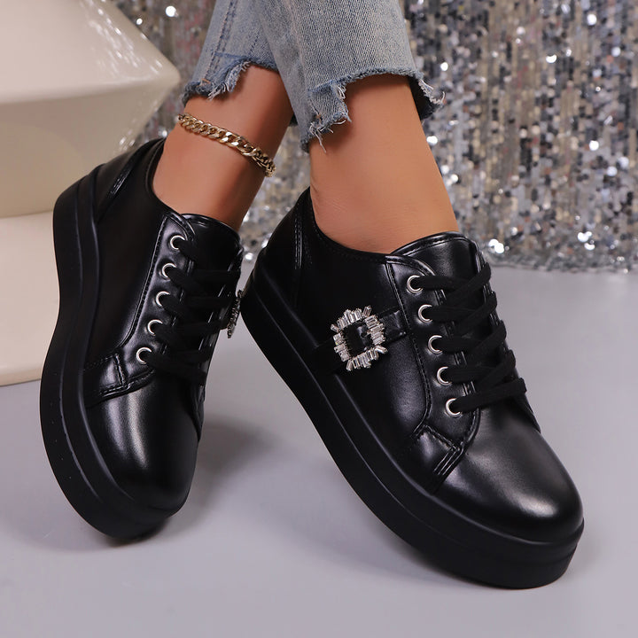Ladies' platform sneaker with metallic upper material, decorative rhinestone buckle, and padded comfort sole Mune Fashion