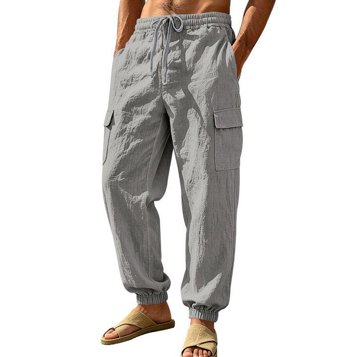 Men's lightweight cargo jogger pants made of linen blend with elastic drawstring waistband, patch flap pockets, and ribbed leg cuffs Mune Fashion
