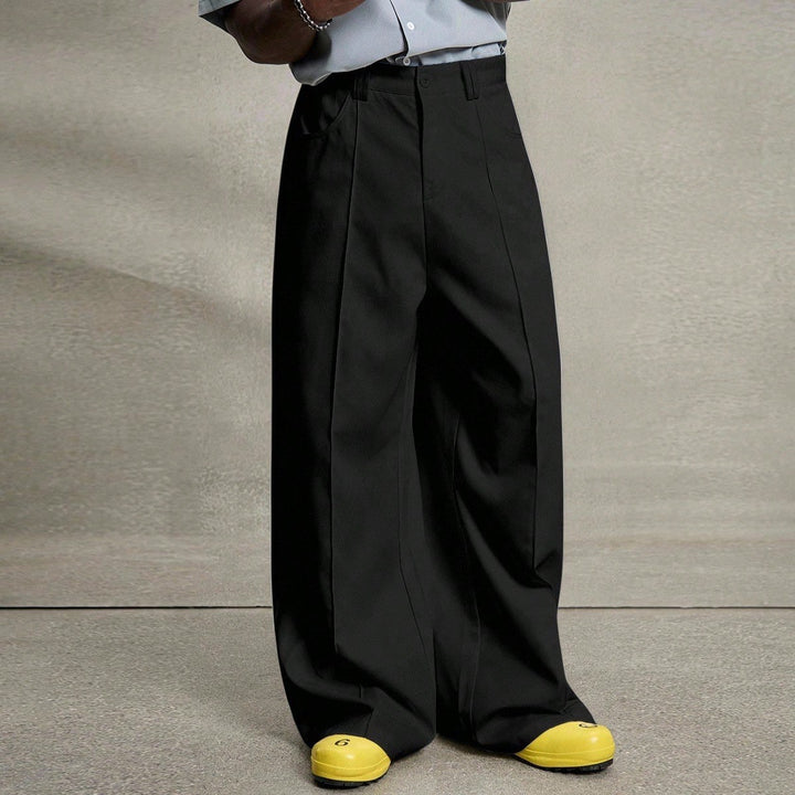Men's wide pleated pants with high waistband, precise creases, and side inset pockets Mune Fashion