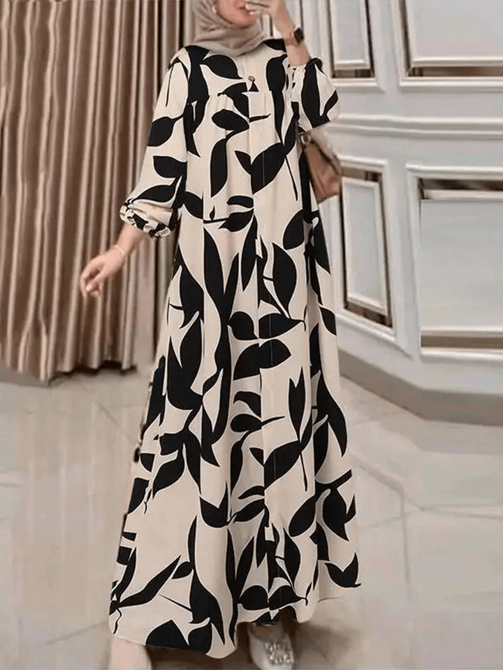 Women's maxi dress with loose A-line cut, flowing fit and eye-catching leaf print Mune Fashion
