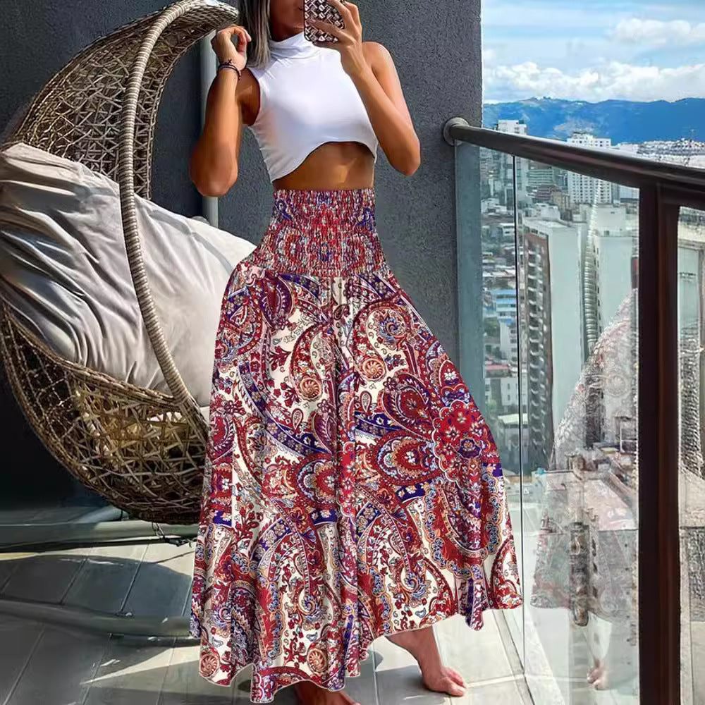 Women's maxi skirt with high smocked waistband, wide fall, and paisley print Mune Fashion