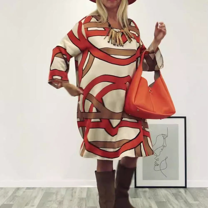 Women's generous swing dress with wide tulip hem, batwing sleeves and graphic all-over pattern Mune Fashion
