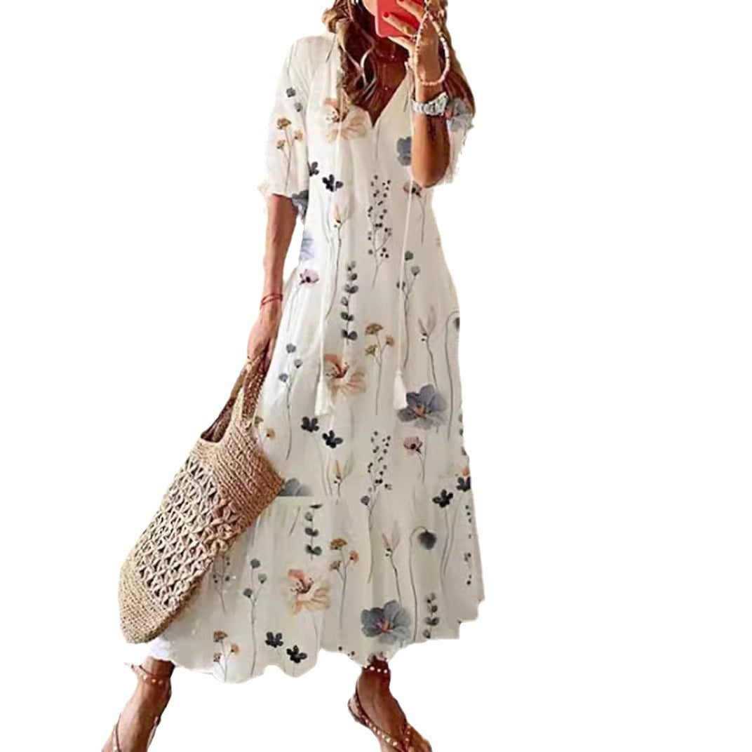 Women’s airy maxi dress in A-line with V-neck, casual rolled sleeves and floral all-over print Mune Fashion