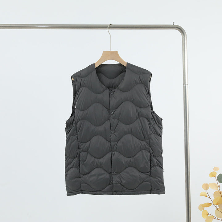 Women’s sleeveless thermal quilted vest with wave-shaped quilting and snap button closure Mune Fashion