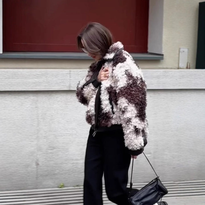 Women's short jacket made of curly bouclé faux fur with leather look detailing Mune Fashion