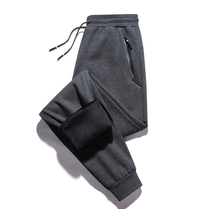 Men's thermo fleece jogging pants with brushed inner side, reflective zipper pockets and drawstring waistband Mune Fashion