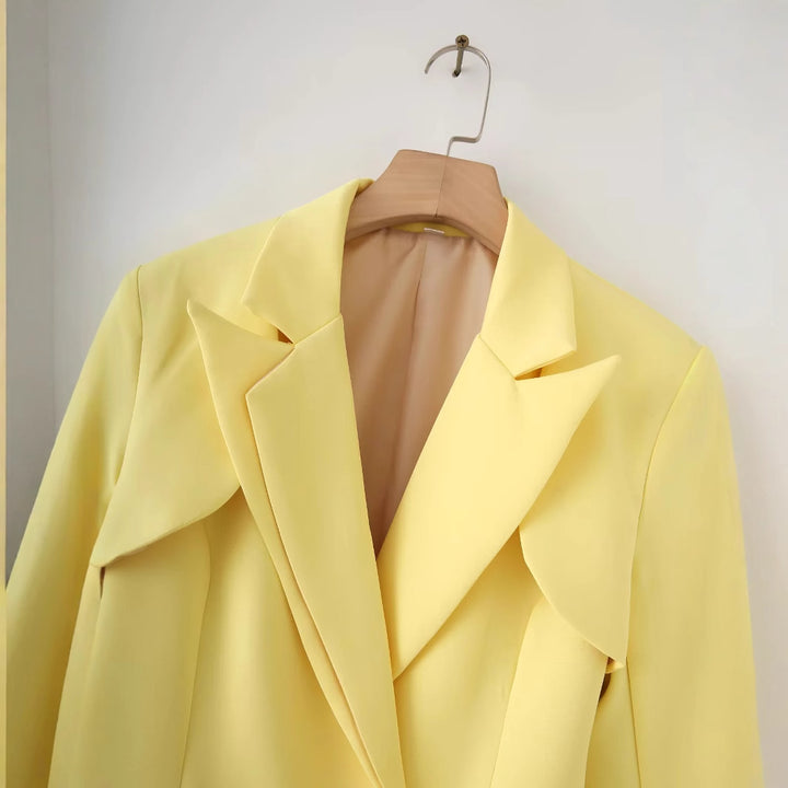 Women's tailored blazer with curved layered collar, figure-flattering darts, and decorative accent button Mune Fashion