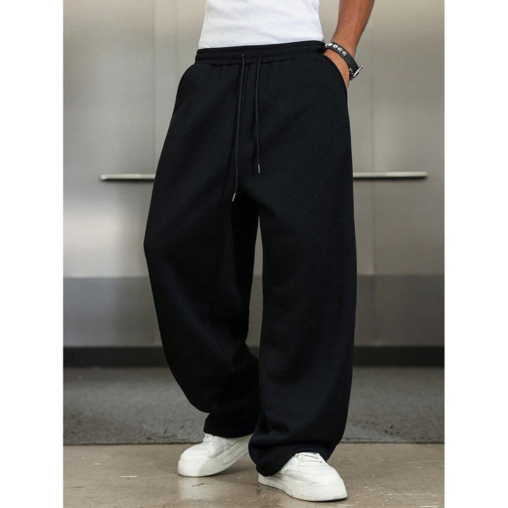 Men's wide Relax fleece pants with a deep crotch, elastic drawstring waistband, and casual side pockets Mune Fashion