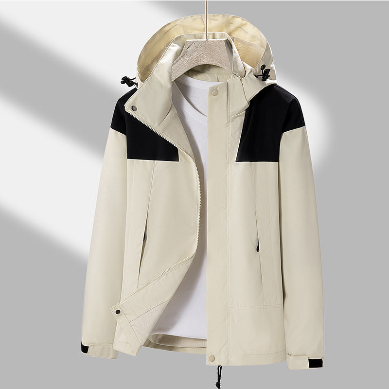 Men's lightweight softshell jacket with contrasting shoulder panel, adjustable hood, and Velcro cuffs Mune Fashion