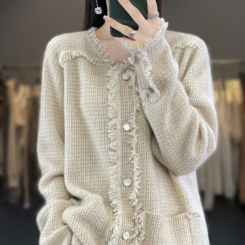 Women's knitted cardigan with fringe trim, mother-of-pearl button placket, and patch pockets Mune Fashion