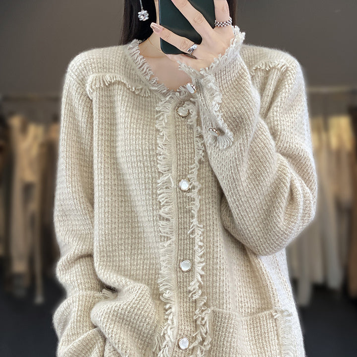 Women's knitted cardigan with fringe trim, mother-of-pearl button placket, and patch pockets Mune Fashion