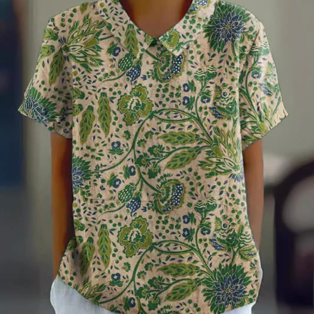 Women's casual short-sleeve blouse with V-neck, rounded hem, and botanical all-over print Mune Fashion