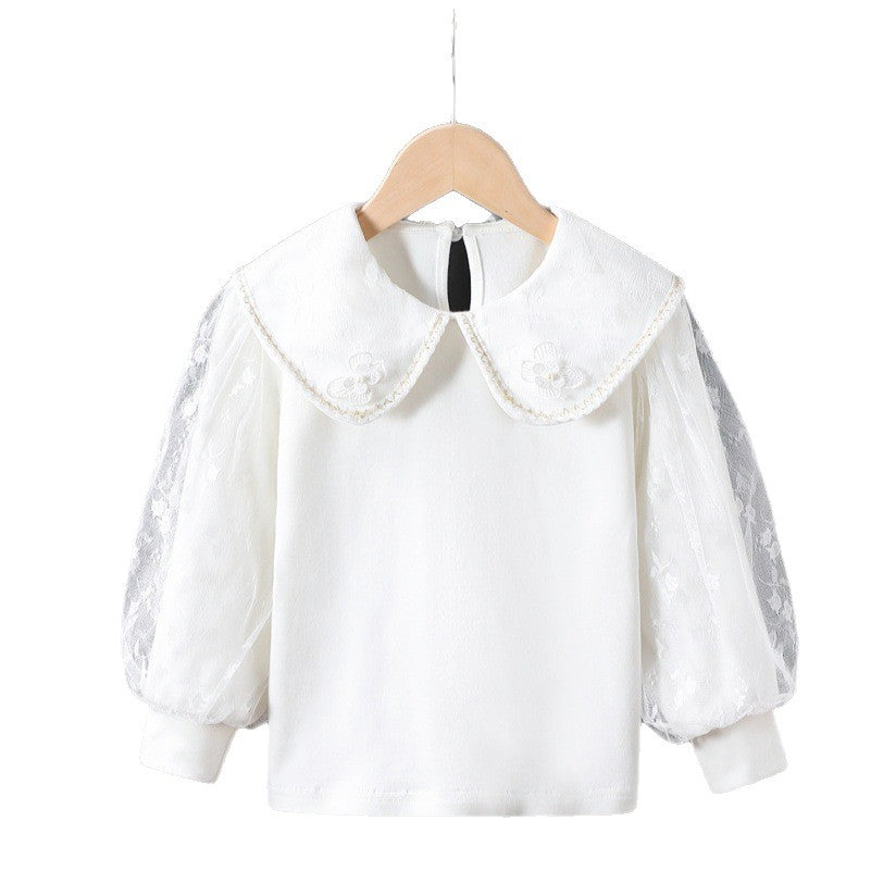 Women's blouse with decorative floral appliqués and transparent puff sleeves Mune Fashion